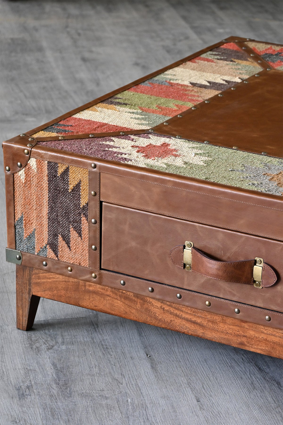 Angled detail of the Mandawa coffee table top, drawer front and mango wood base