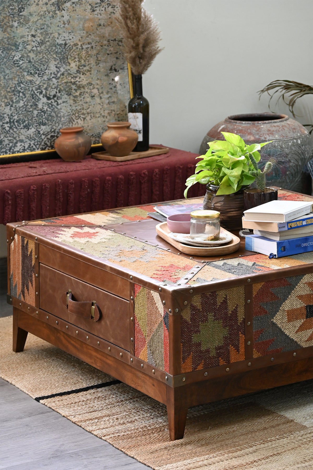 Mandawa kilim coffee table from the left, styled with books, tray and plant