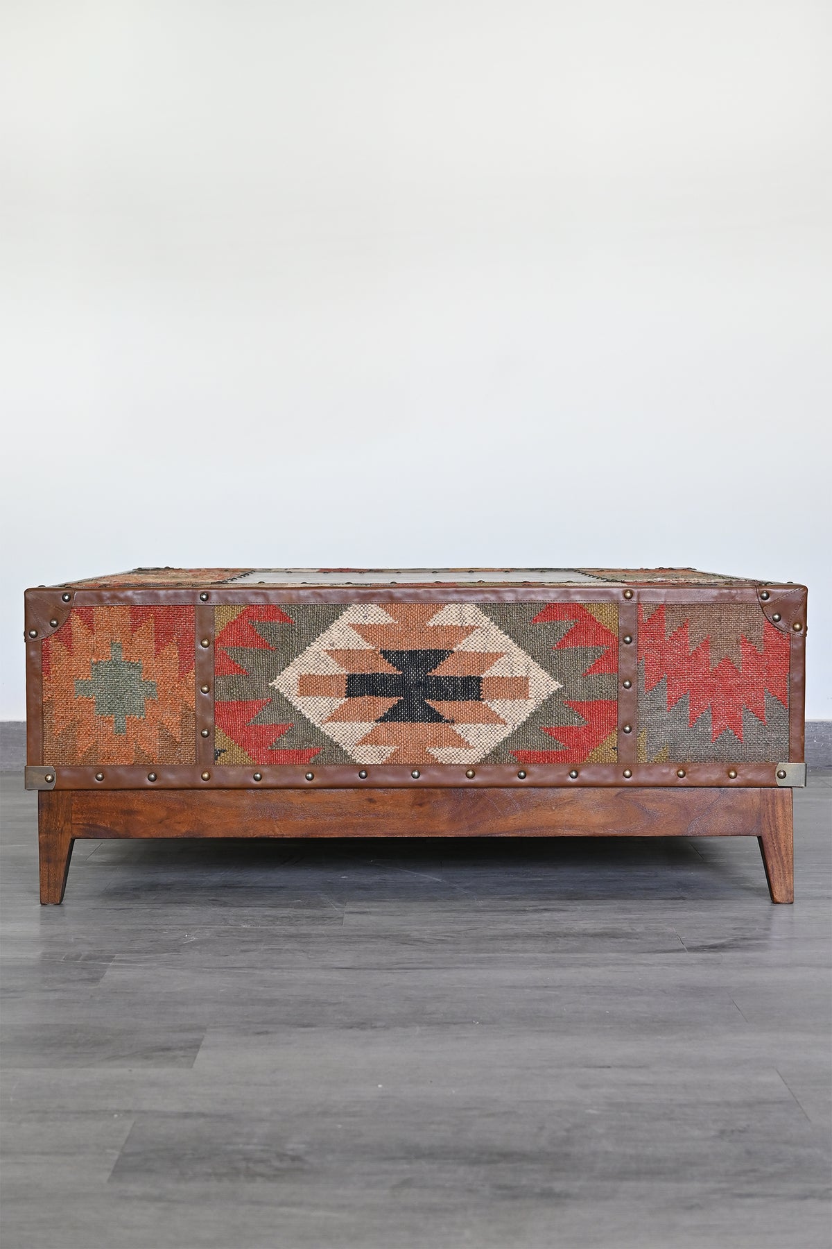 Kilim side elevation of the Mandawa trunk coffee table on a mango wood plinth