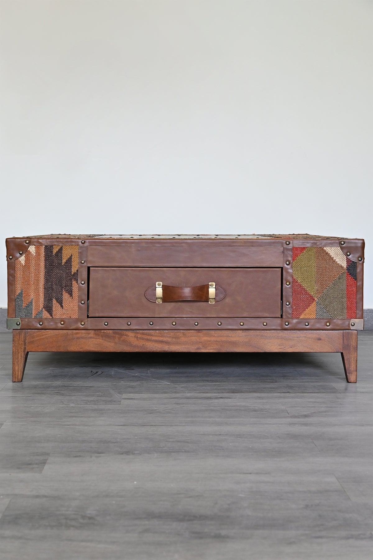 Drawer-face elevation of the Mandawa kilim trunk coffee table with brass strap handle