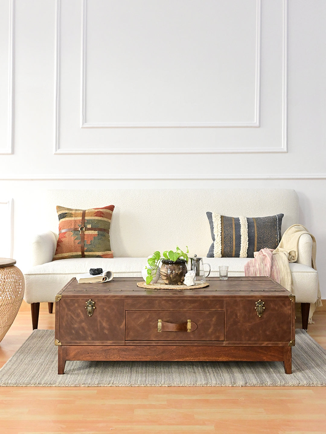 Nawalgarh leather trunk coffee table styled in front of a bouclé sofa — Art Avenue, made to order
