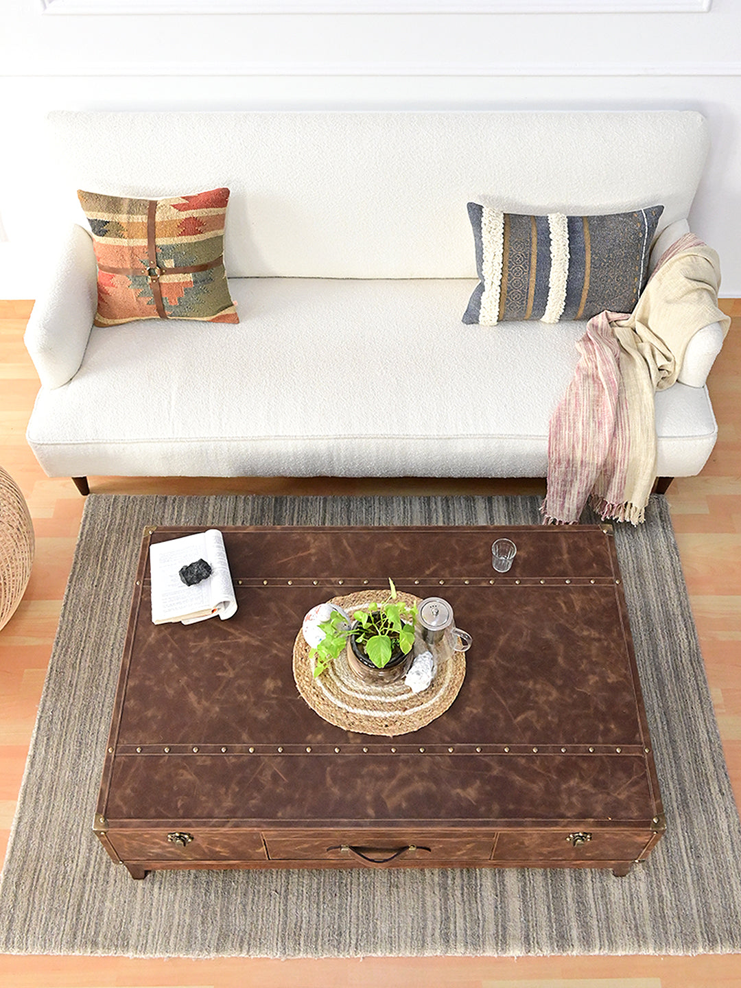 Nawalgarh leather trunk coffee table from overhead, three-panel top in a styled room