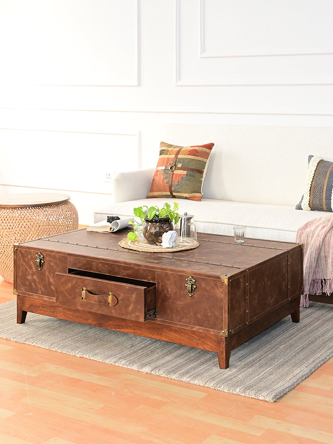 Nawalgarh leather trunk coffee table, three-quarter view with the front drawer pulled out