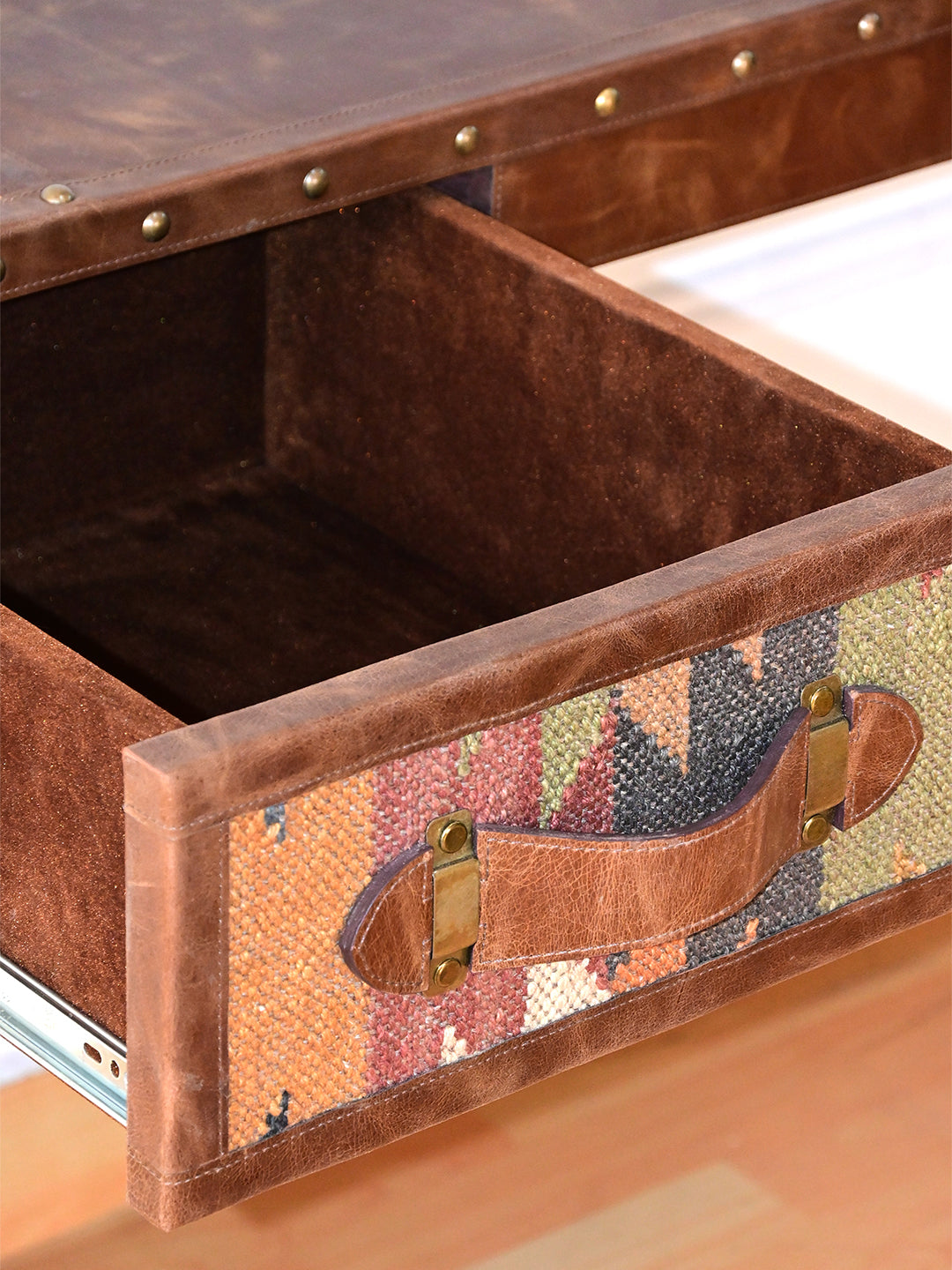 Inside an open drawer of the Dungarpur desk, lined in velvet-nap suede