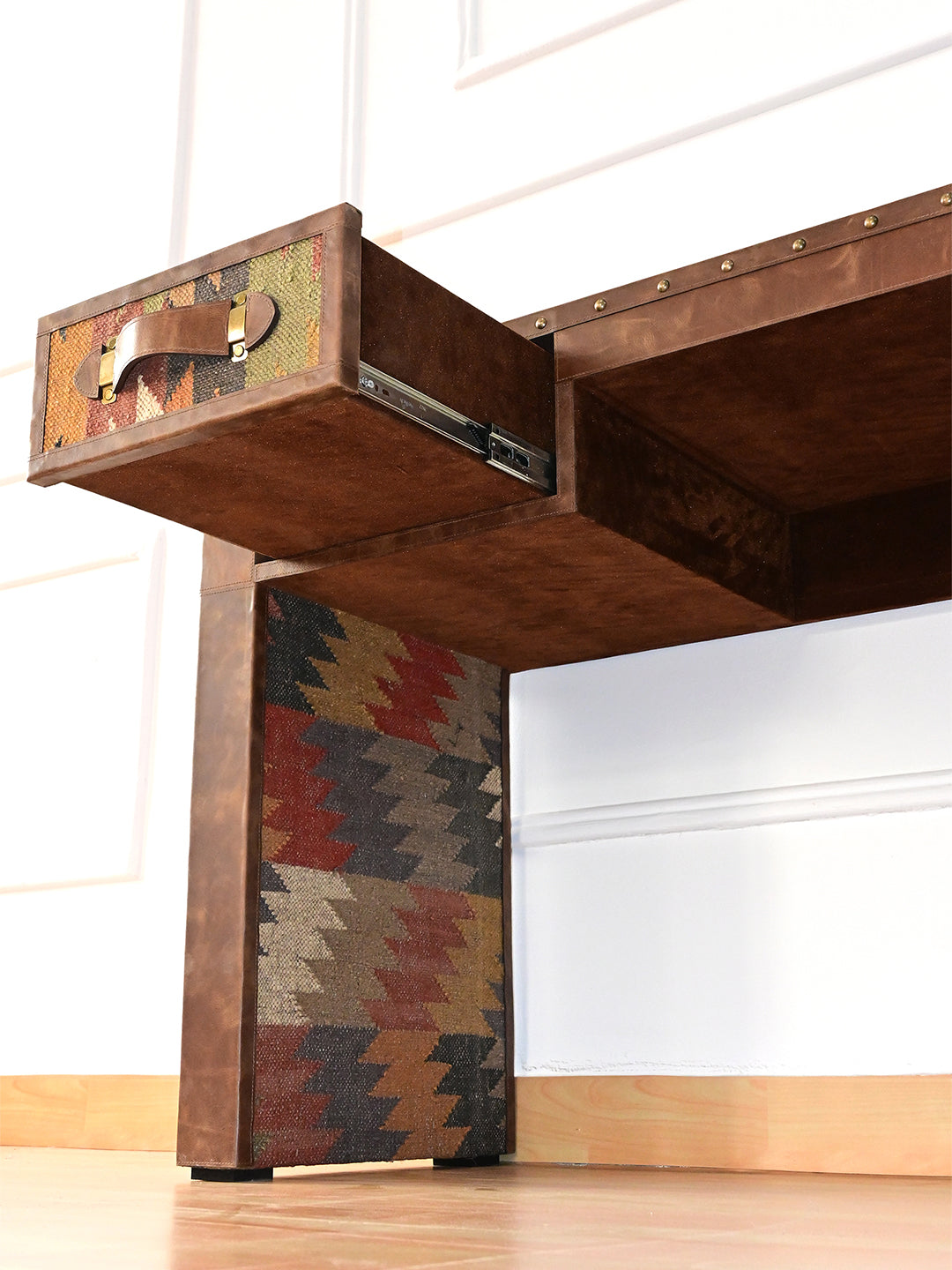 Drawer extended above the inner kilim panel of the Dungarpur desk leg