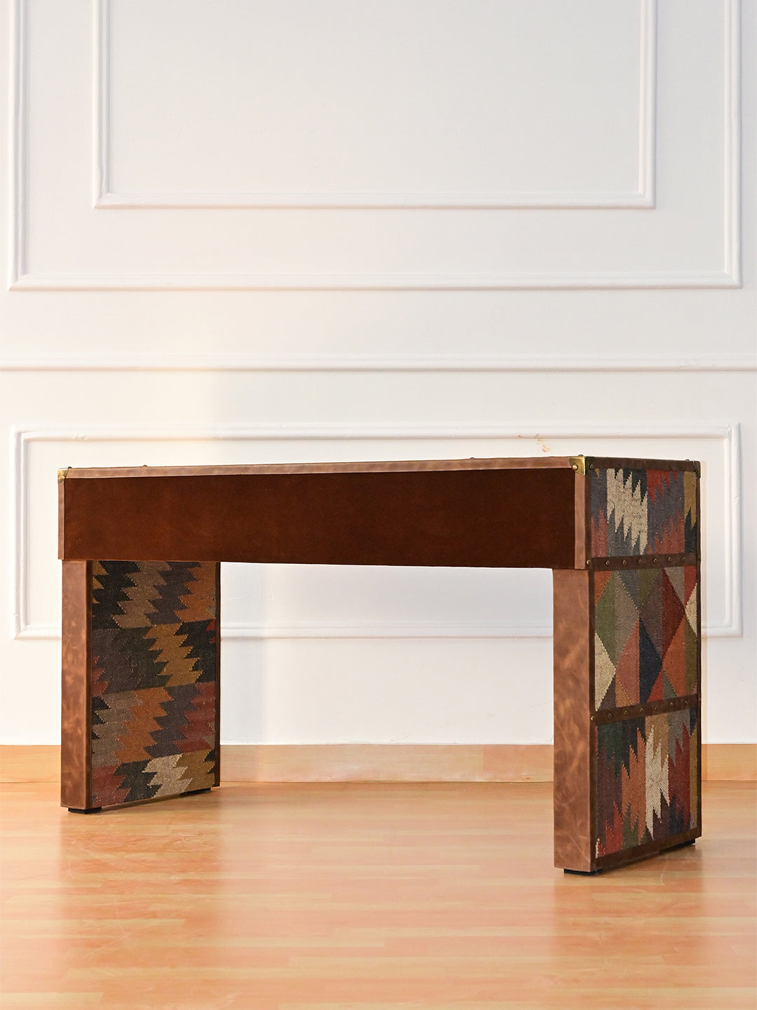 Rear three-quarter view of the Dungarpur desk showing the inner kilim leg panels