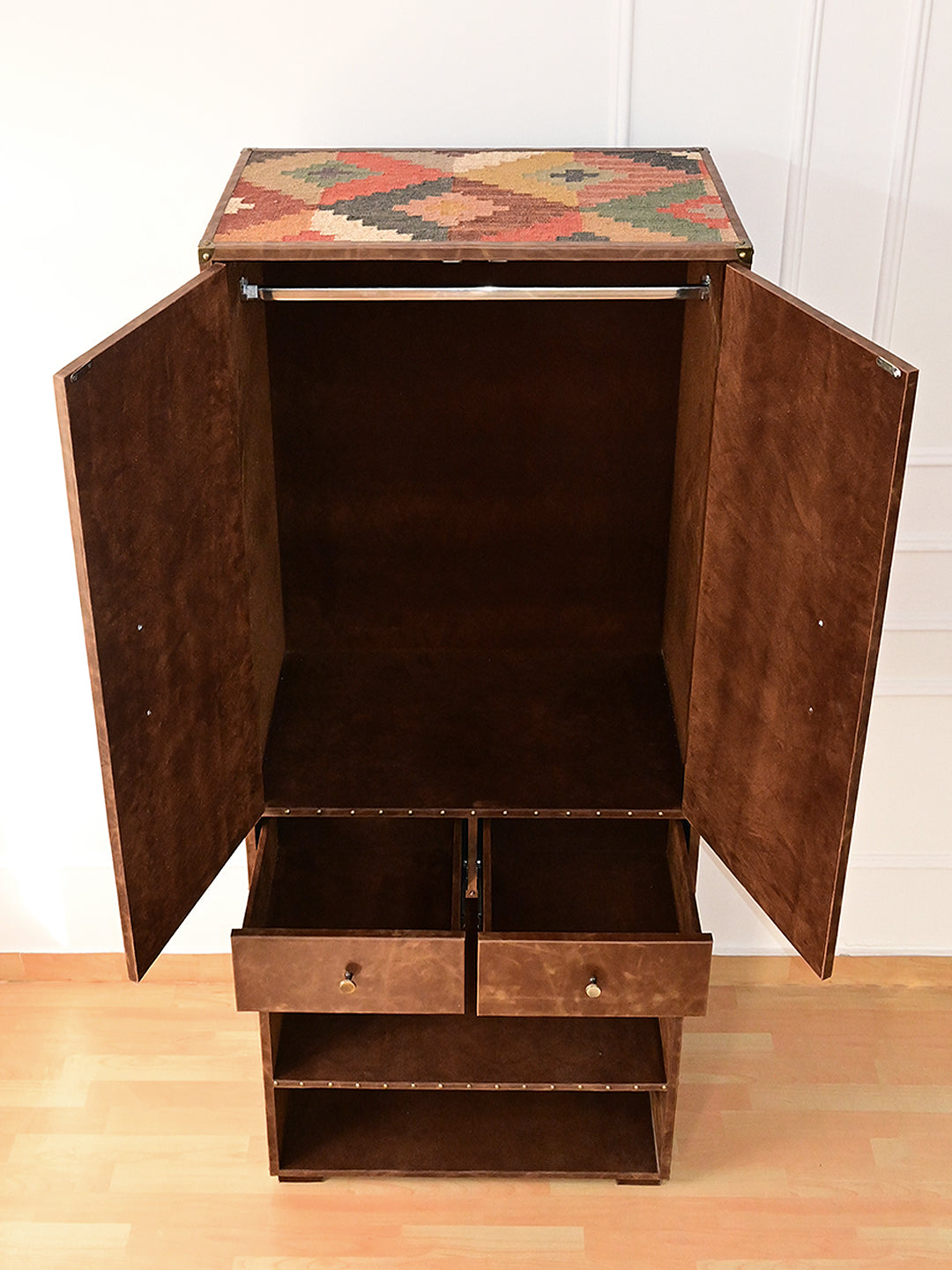 Top-down view of the Alsisar wardrobe showing the vintage kilim top panel and open drawers