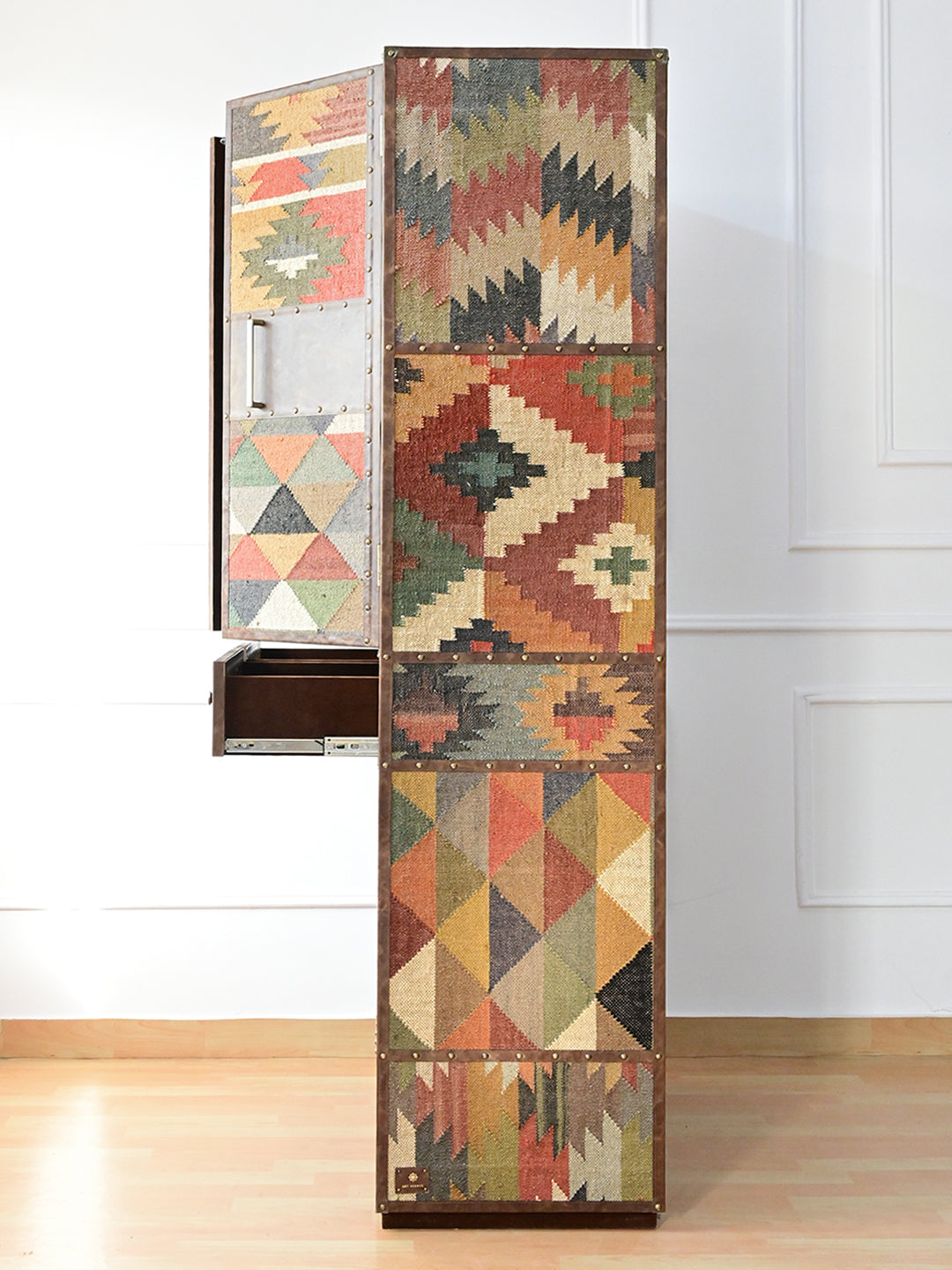 Side view of the Alsisar wardrobe with a door and a drawer open on runners