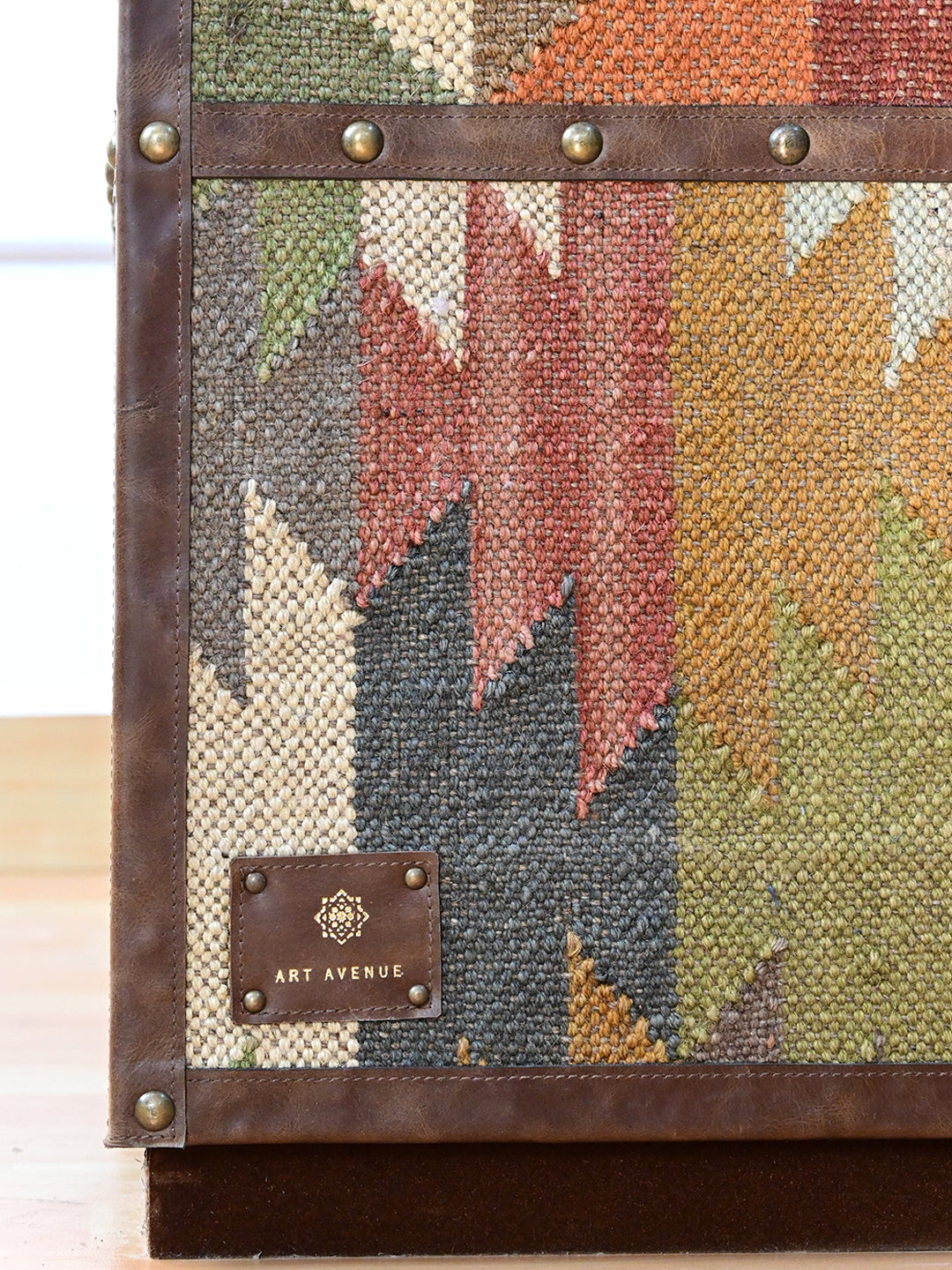 Art Avenue leather maker's tag on the kilim flank of the Alsisar wardrobe