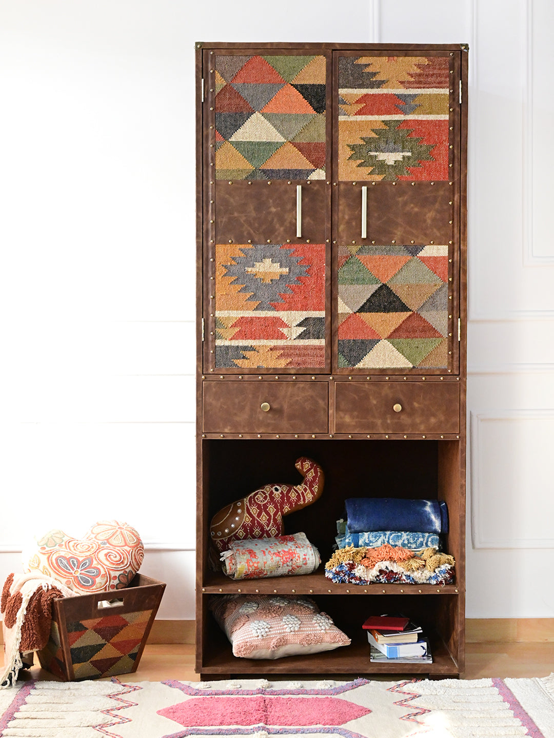 Alsisar wardrobe styled front-on with cushions and textiles on the open shelves, Art Avenue