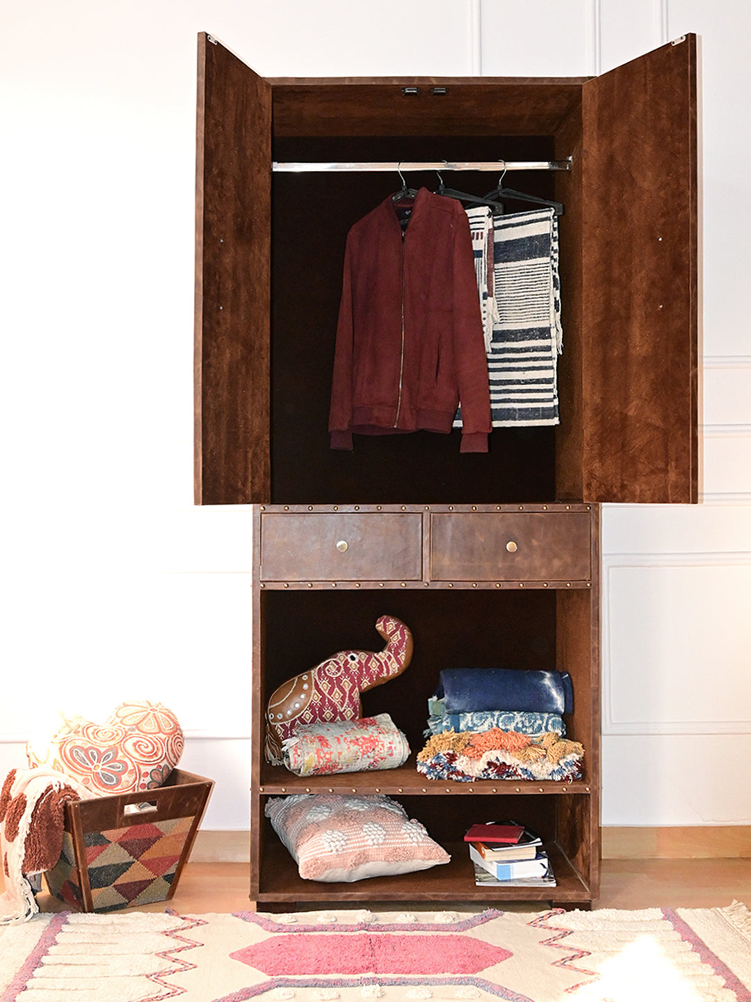 Alsisar wardrobe with doors open showing the hanging rail and clothes, lower shelves styled