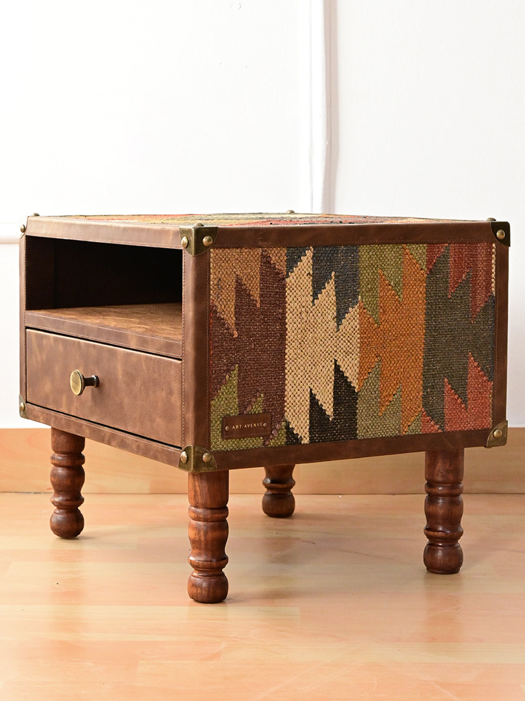 Detail of a cast brass corner cap on double-stitched leather binding, Mahansar bedside table