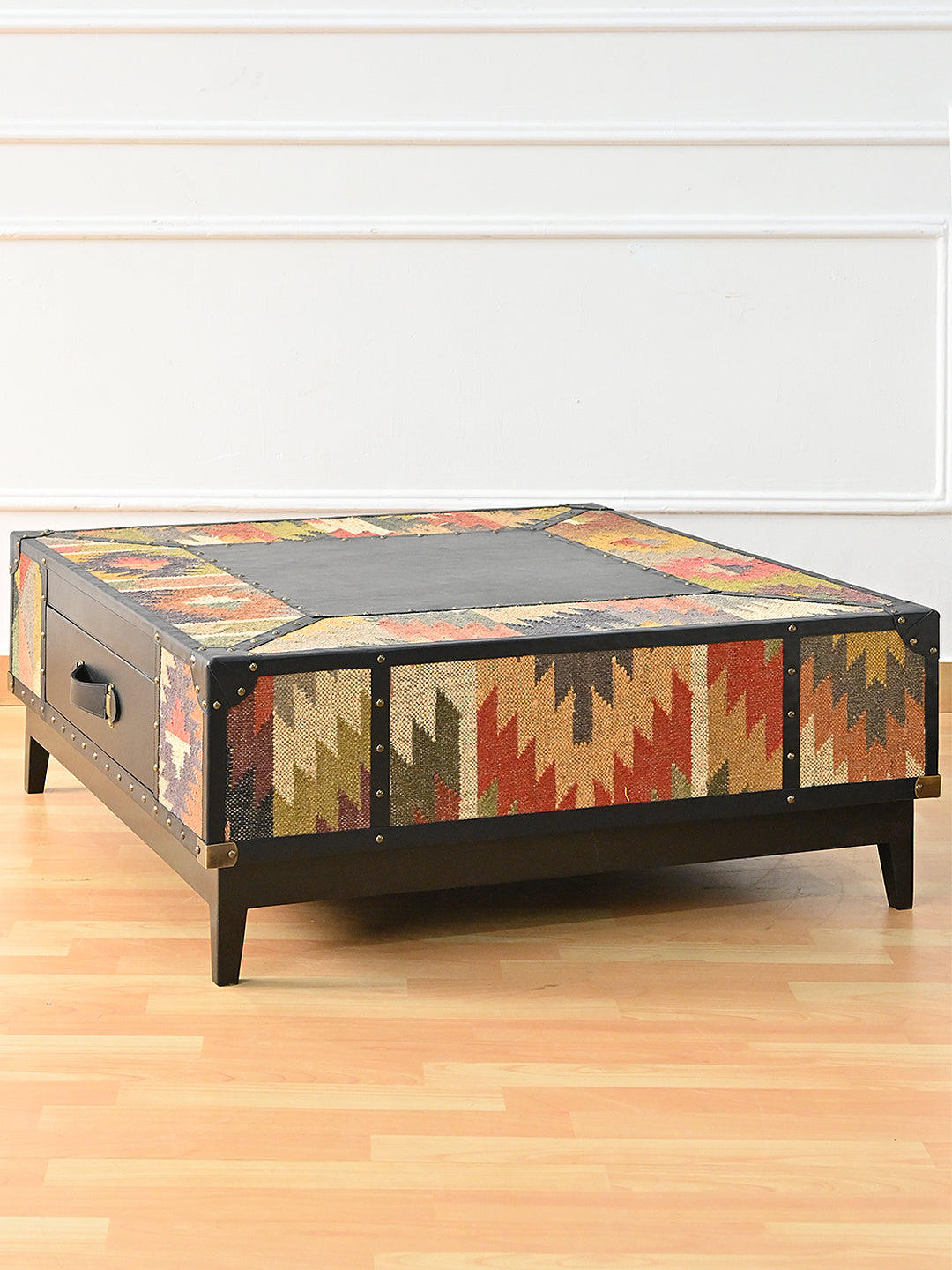 Mehrangarh coffee table from the opposite corner, kilim on all four faces over a tapered solid wood plinth, Art Avenue