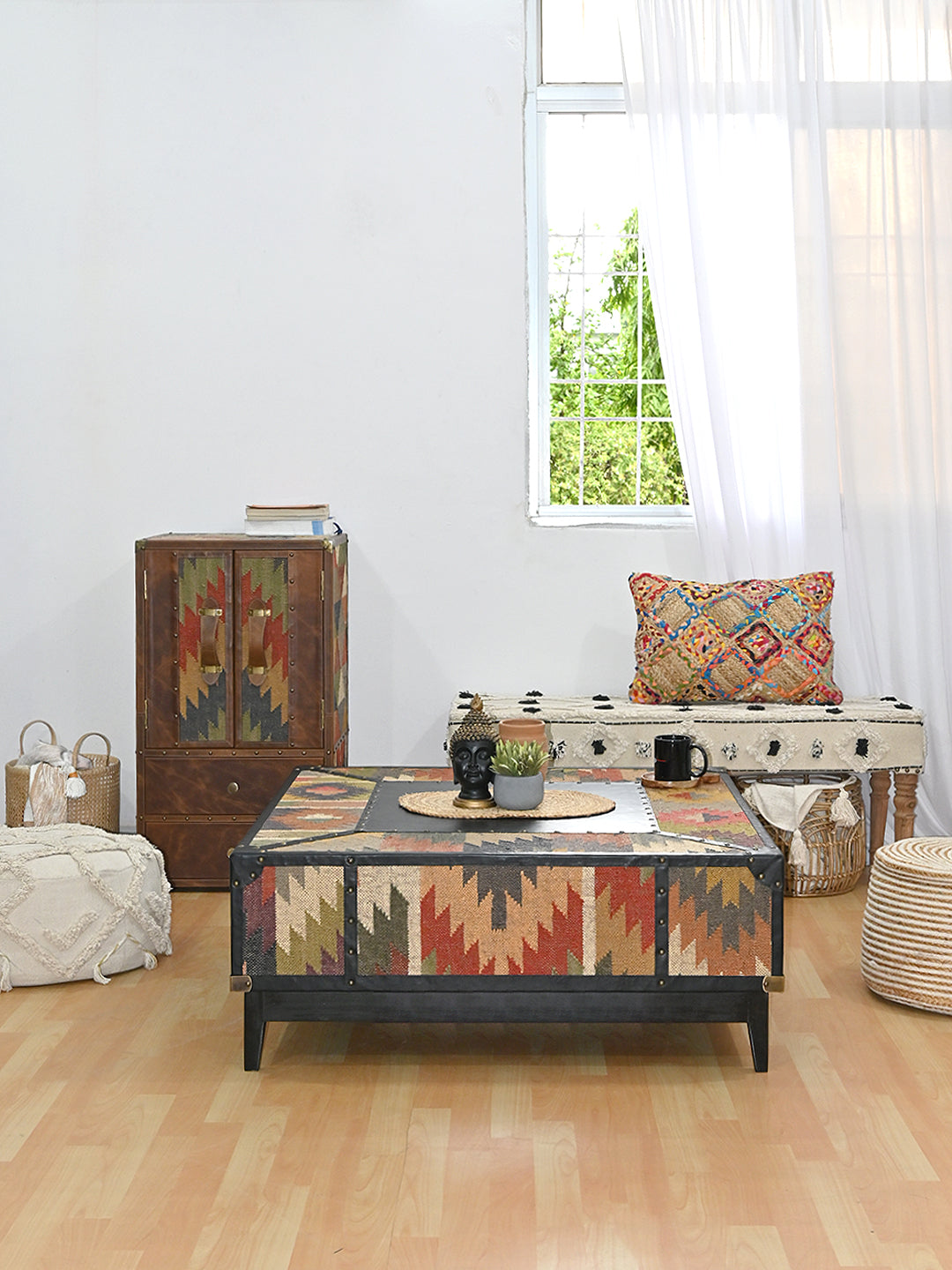 Mehrangarh kilim trunk coffee table styled in a living room with a kilim cabinet and woven bench, Art Avenue, made to order