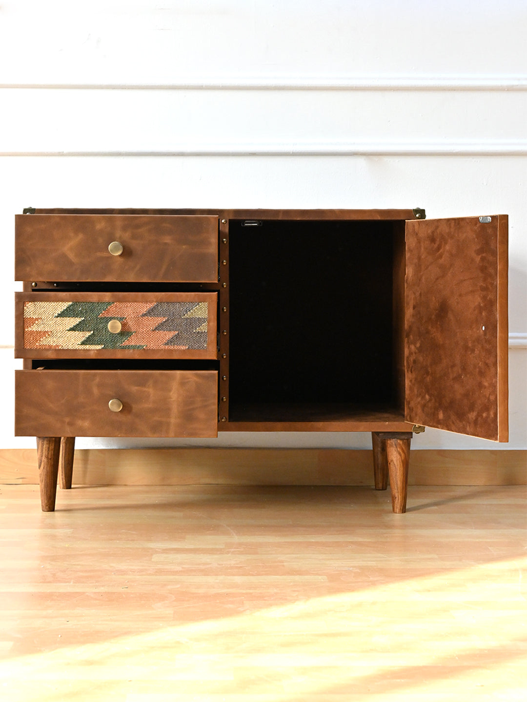 Kanota sideboard by Art Avenue with drawers pulled out and door open to a single open compartment with a nap-lined door