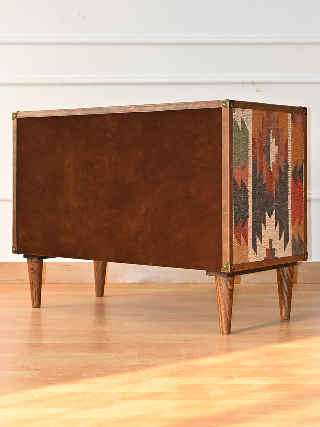 Rear three-quarter view of the Kanota sideboard by Art Avenue, nap-finished back and kilim side panel