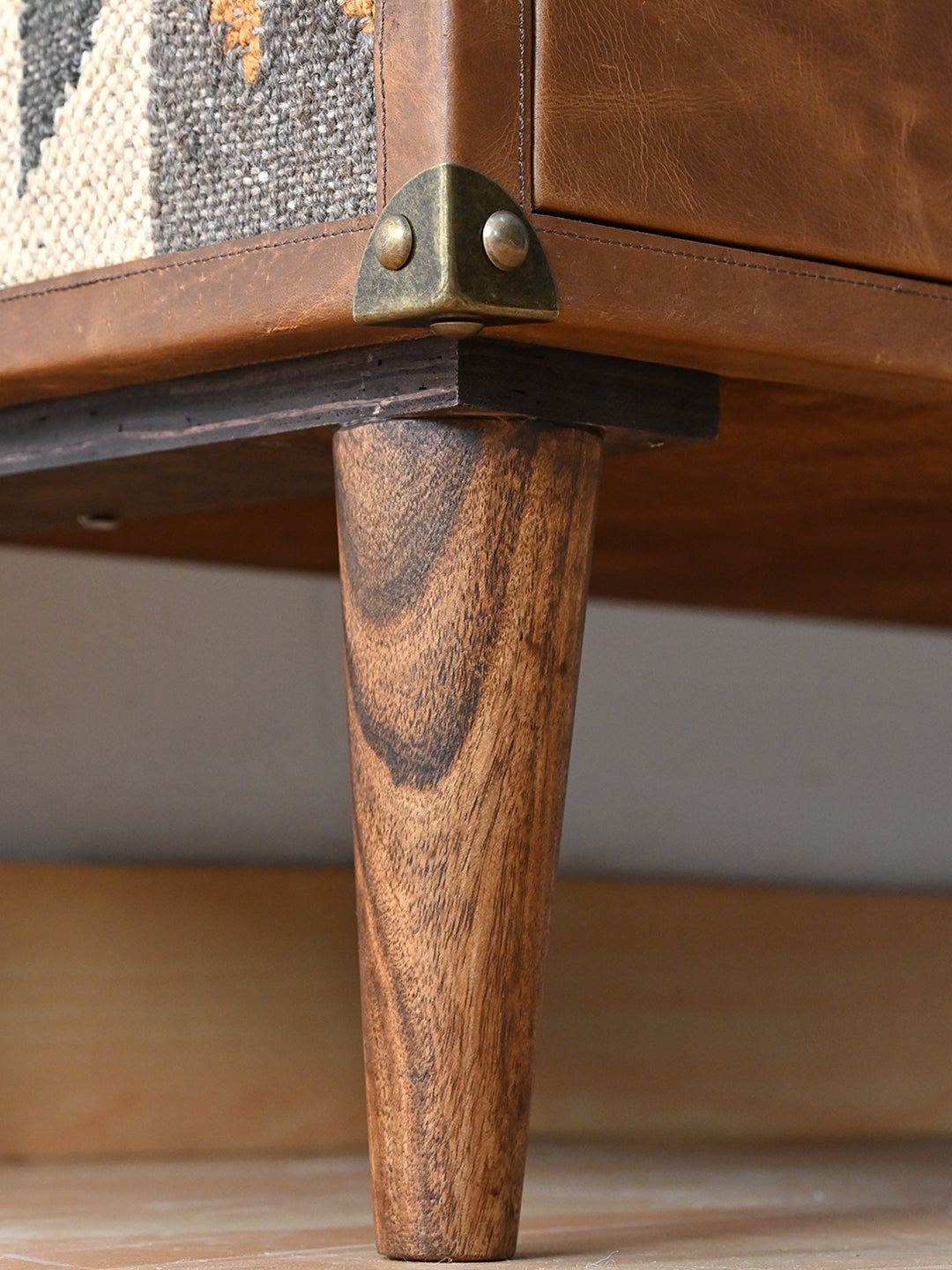 Tapered solid wood leg and brass corner cap on the Kanota sideboard by Art Avenue