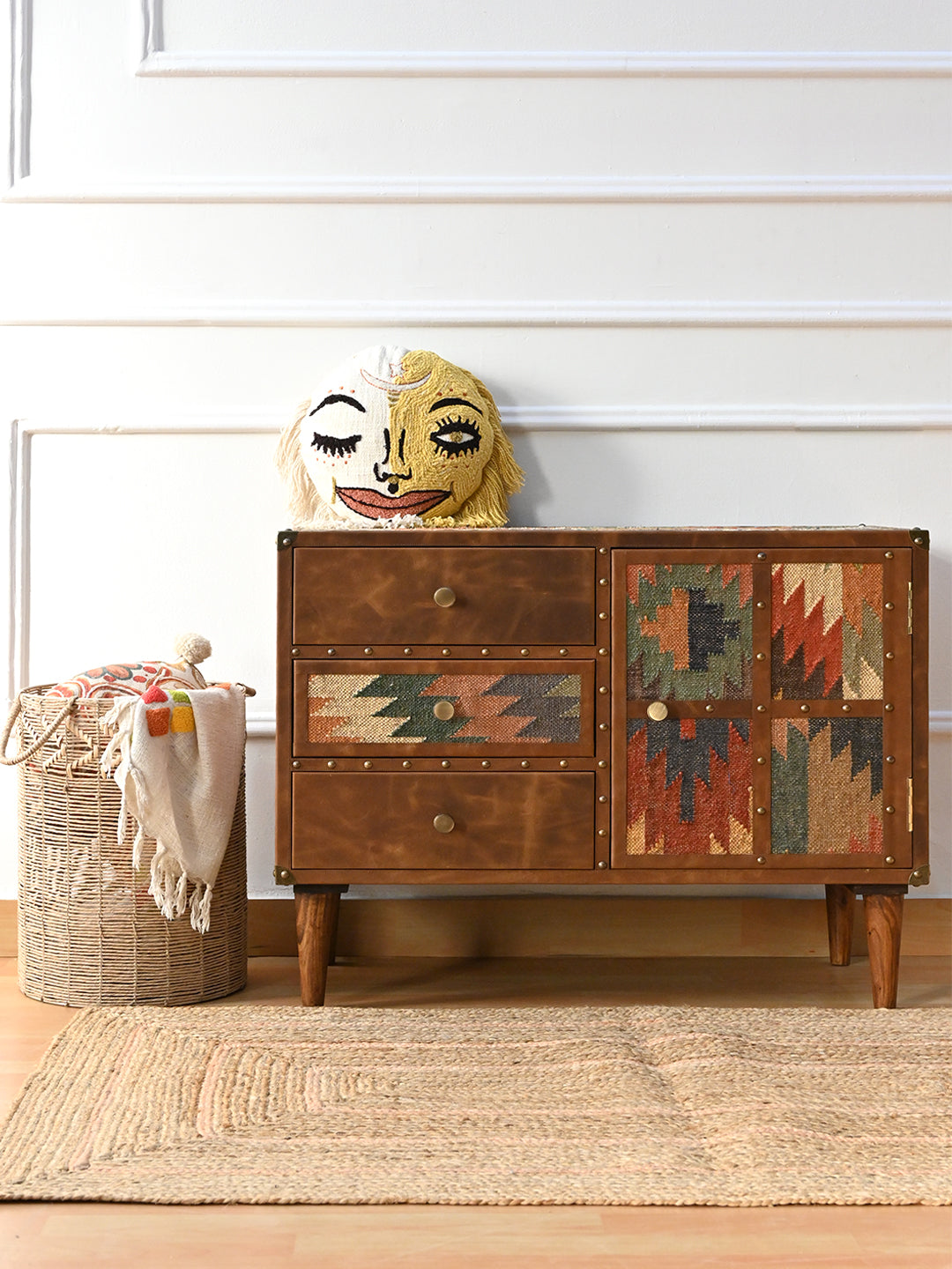 Kanota sideboard by Art Avenue styled with an embroidered face cushion on top, alternate view