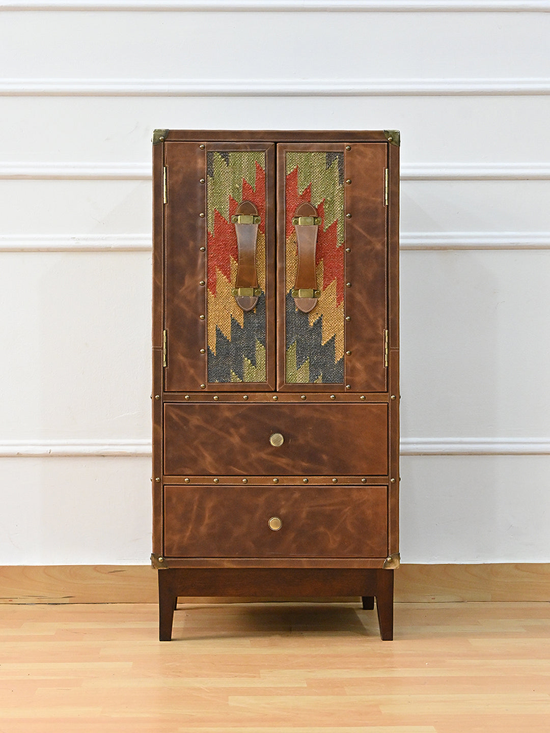 Shalimar cabinet front elevation — leather doors with vintage kilim inset panels over two leather drawers, Art Avenue