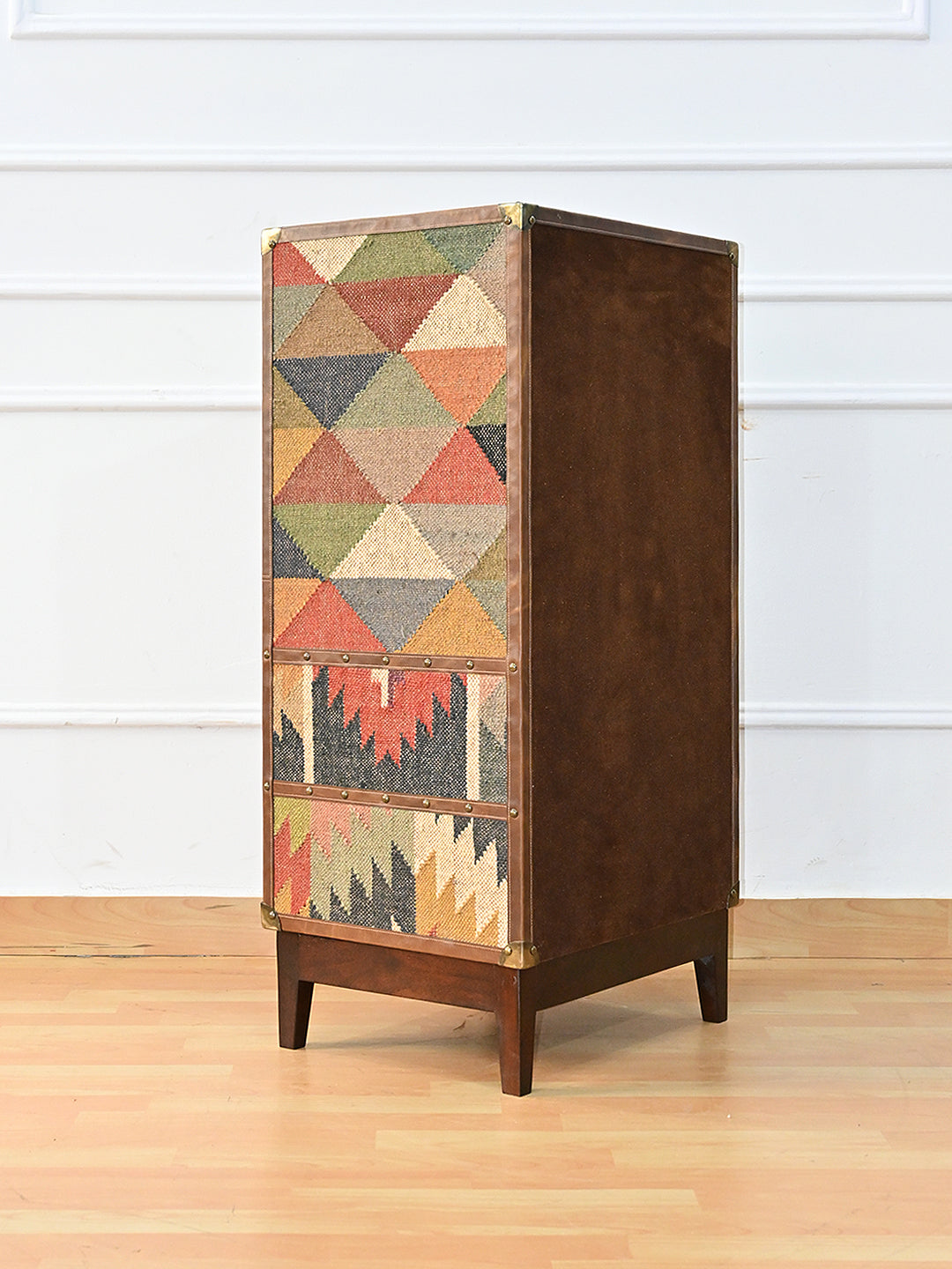 Rear three-quarter of the Shalimar cabinet — kilim flank beside the suede-lined back panel, Art Avenue