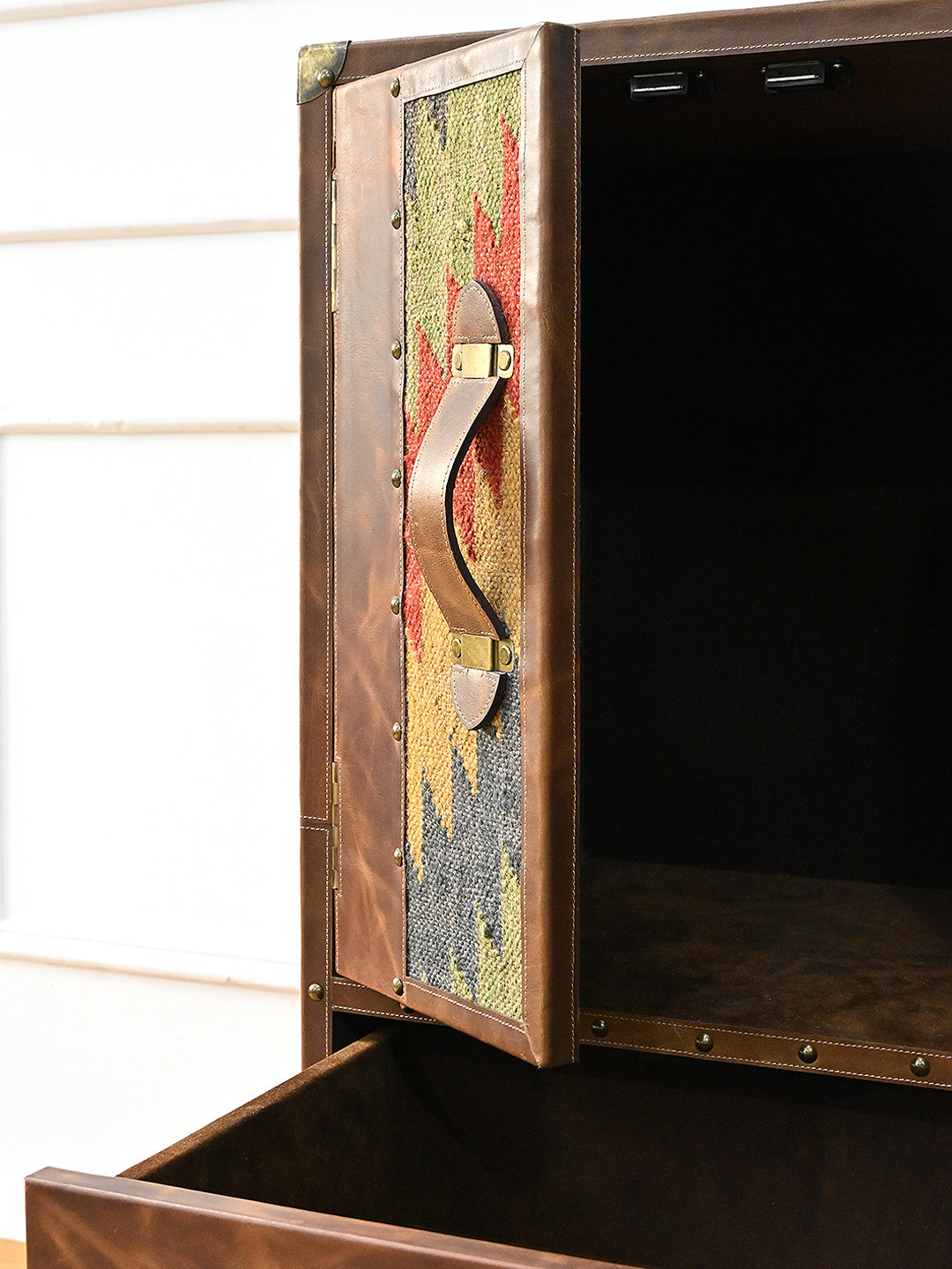 Open door of the Shalimar cabinet showing the suede-lined interior and kilim-backed door panel — Art Avenue
