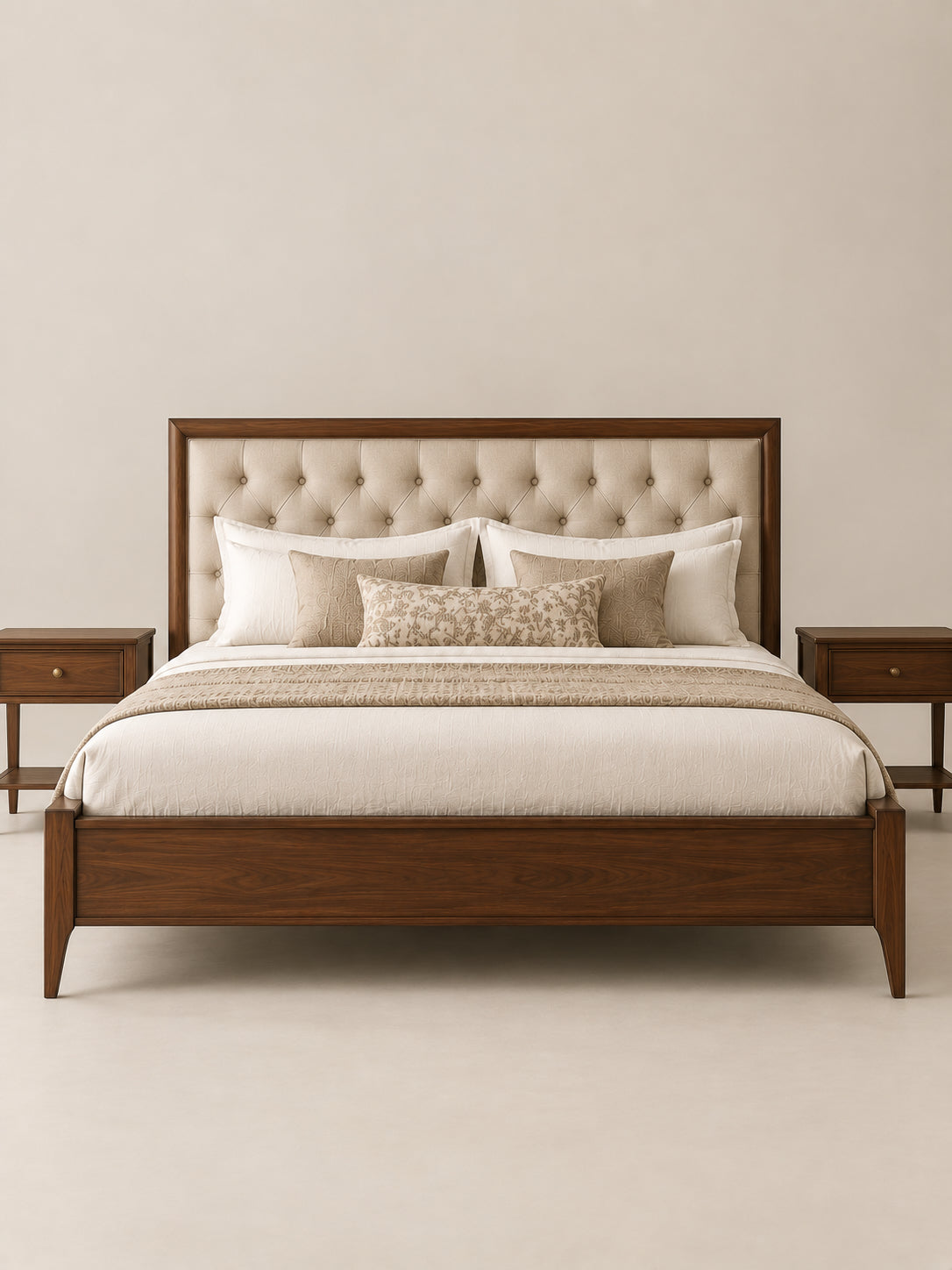 Landour Tufted Upholstered Bed from the front between a pair of Landour bedside tables — buttoned Oat linen headboard, low panelled footboard and square tapered legs in Walnut. Art Avenue, made to order.